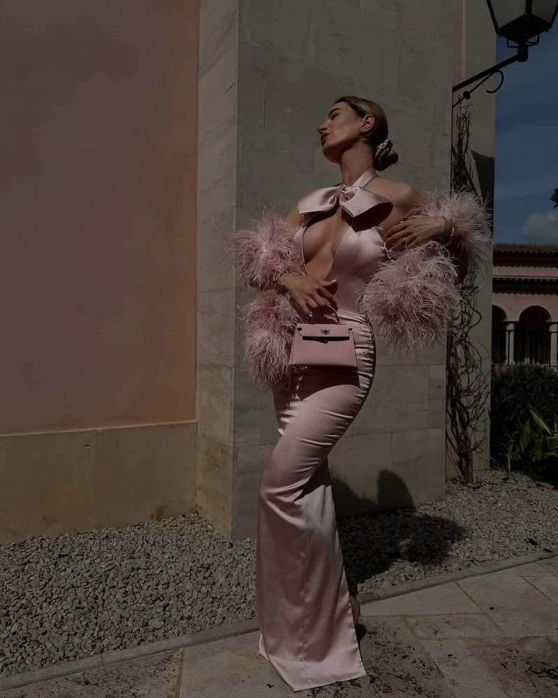 Lena Terlutter German entrepreneur and fashion icon, embraces wedding season in Mallorca wearing a pastel pink gown.